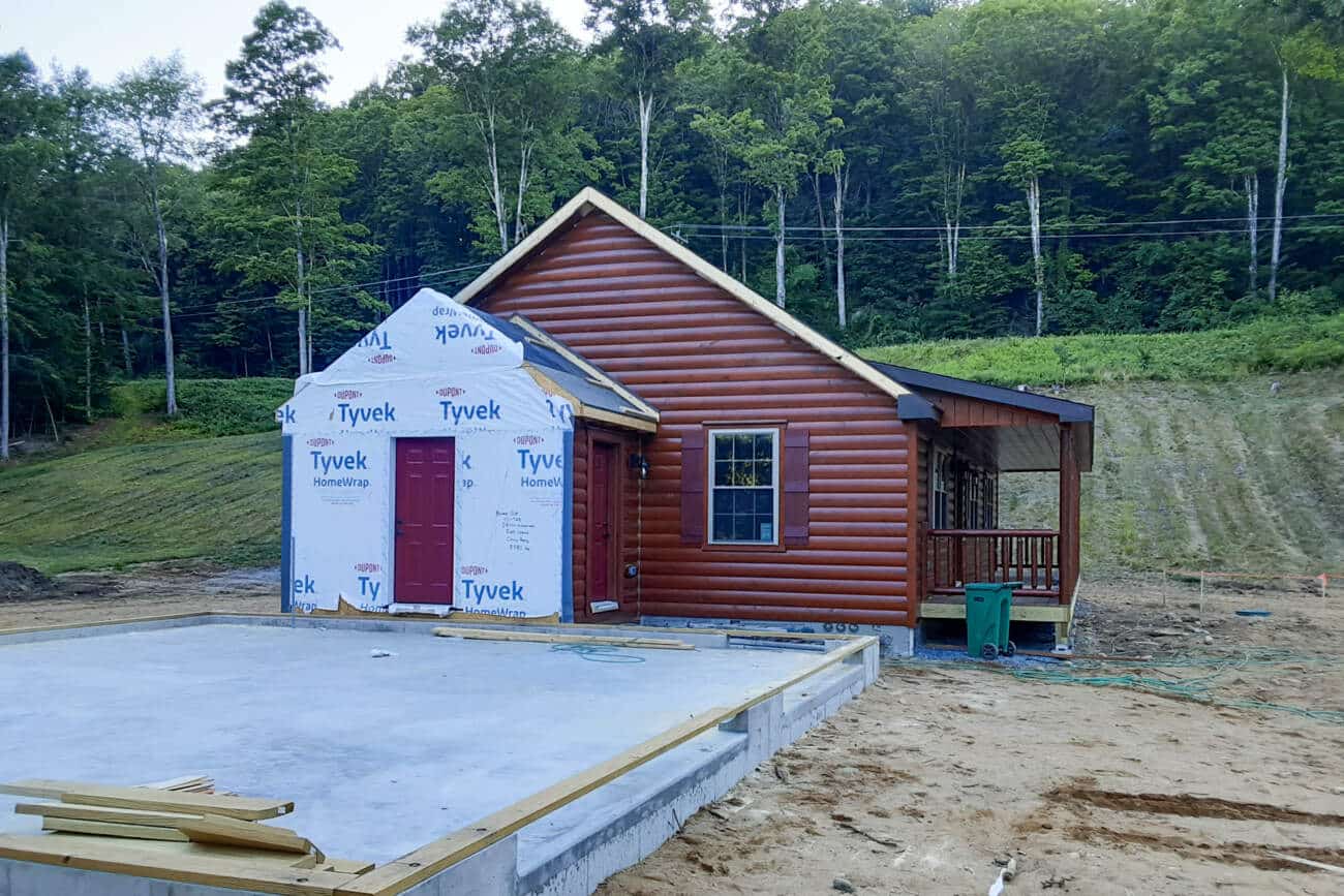 garage foundation beside Prefab Cabin in Dummerston VT