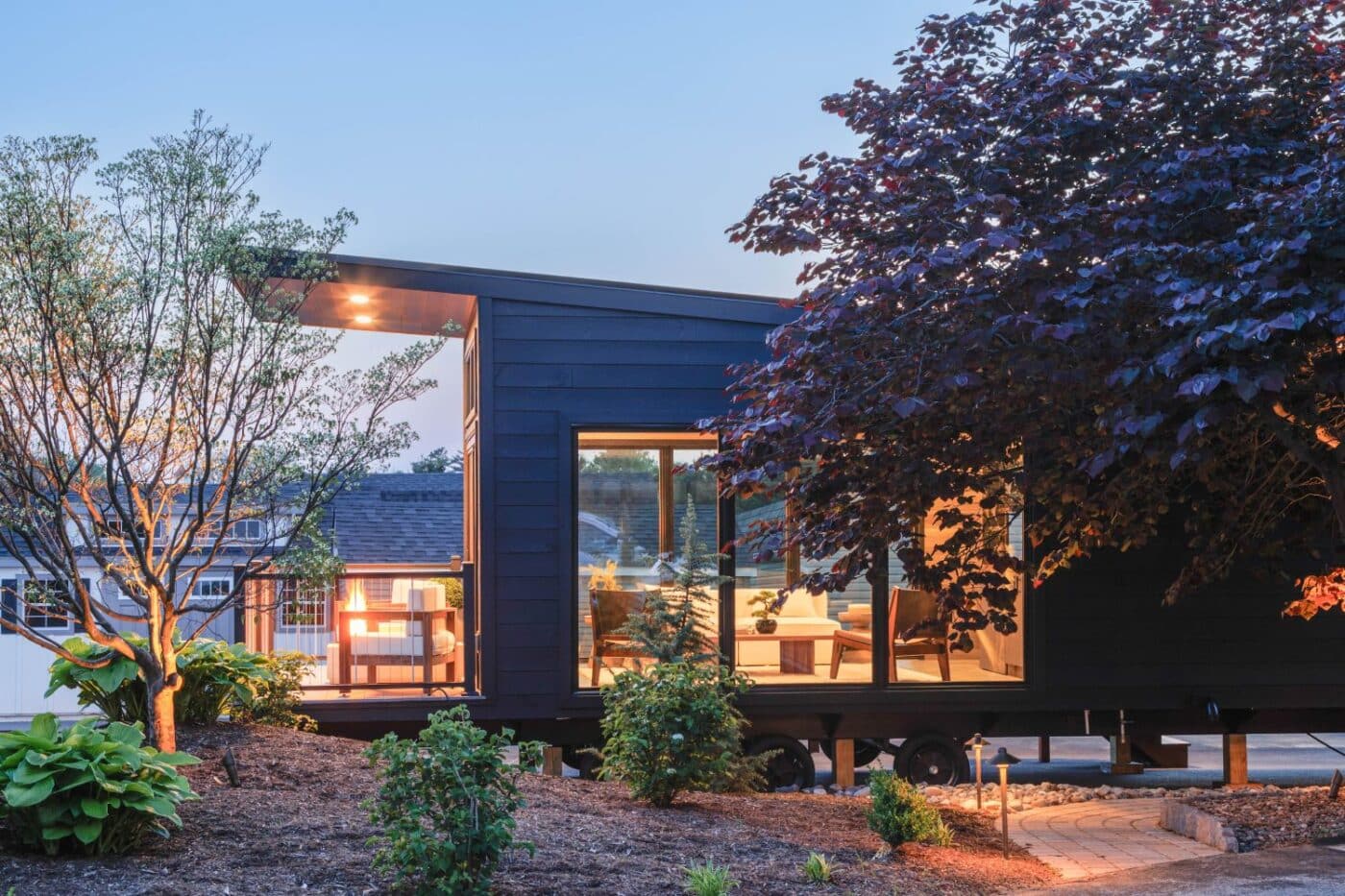 Park Model parked in lot at dusk