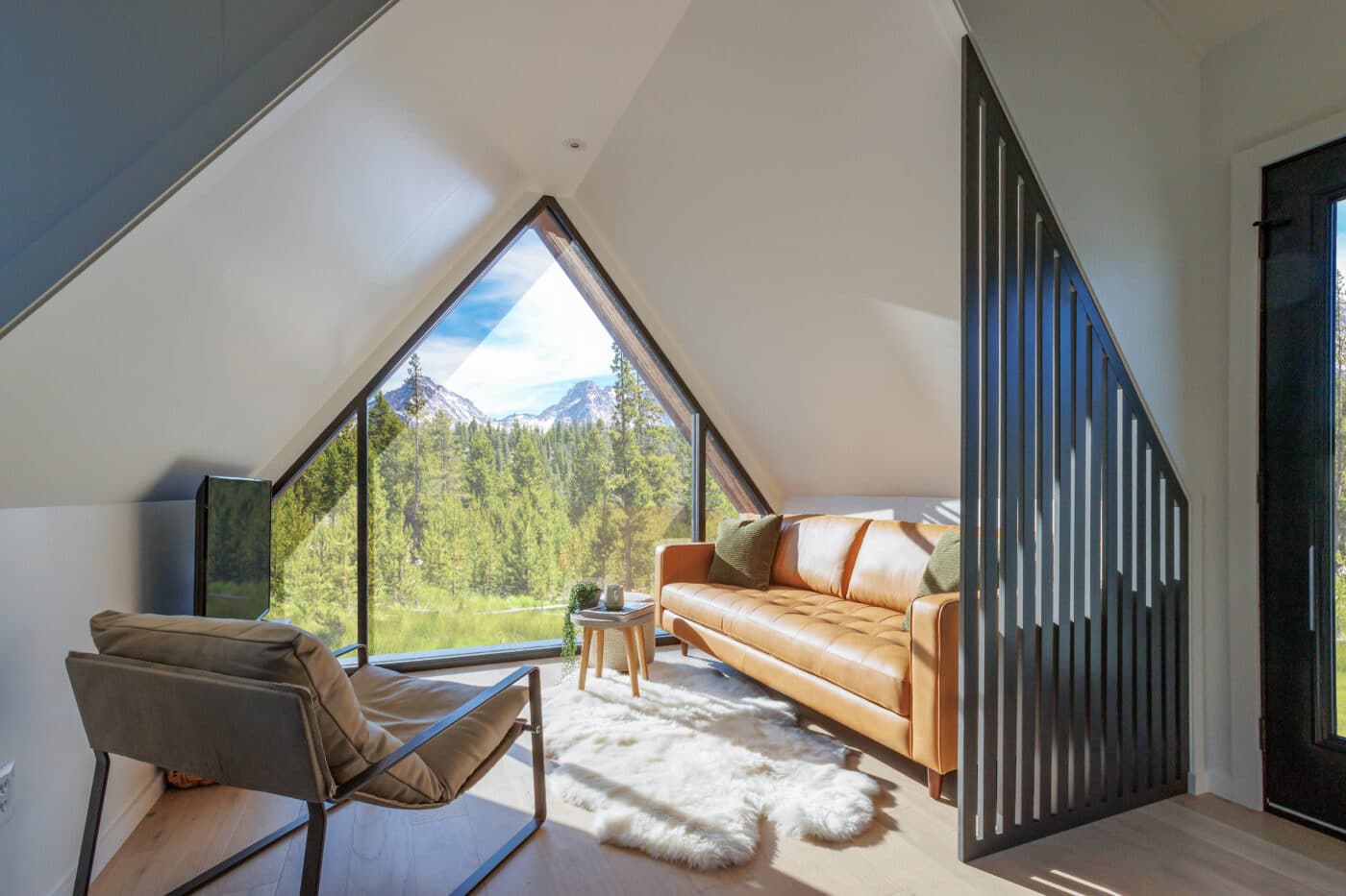 A Frame Interior with view of window and outdoor as well as sofa and living space