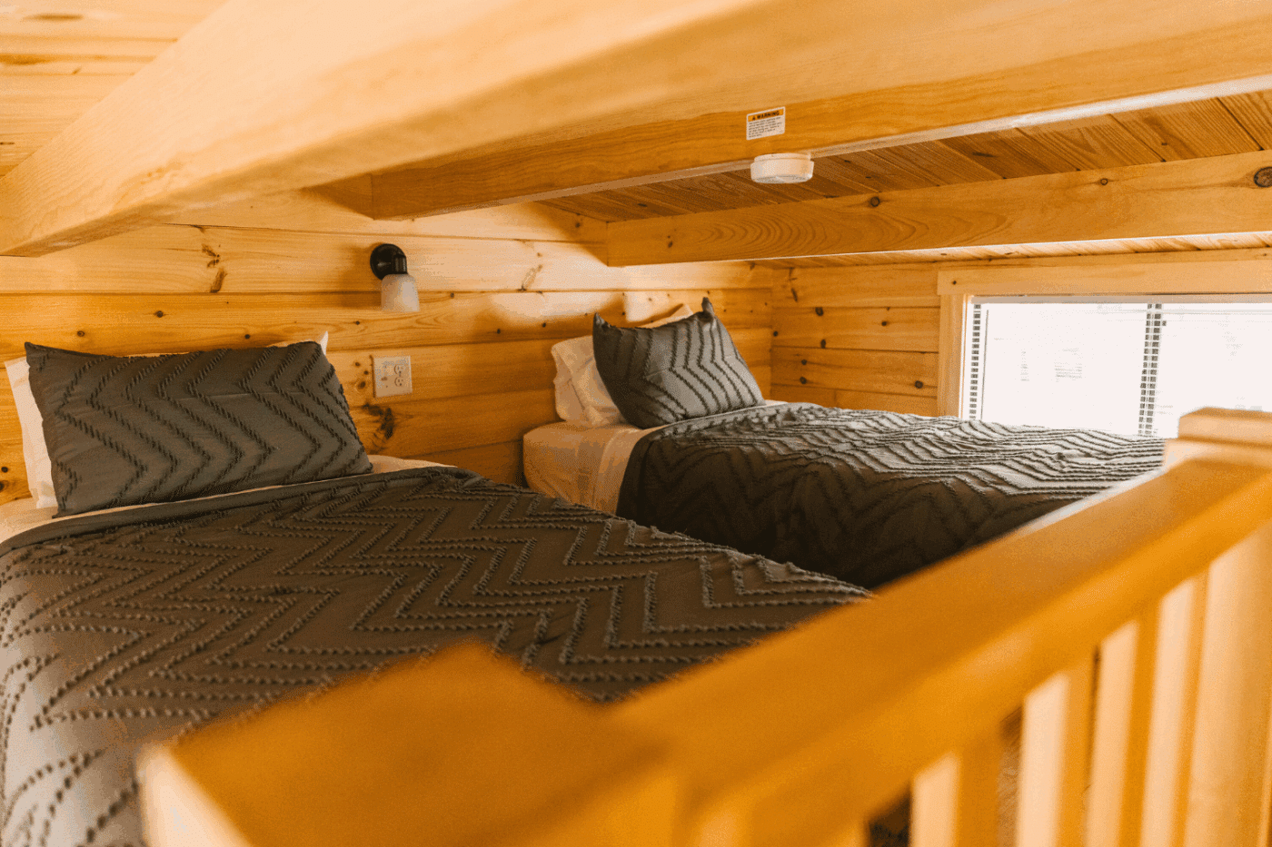 lofted sleeping area in a pinecrest park model tiny hom e