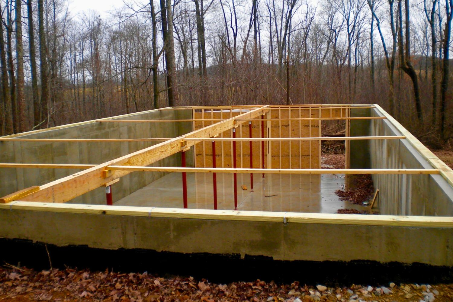 Inside full basement foundation before log cabin  is placed on top