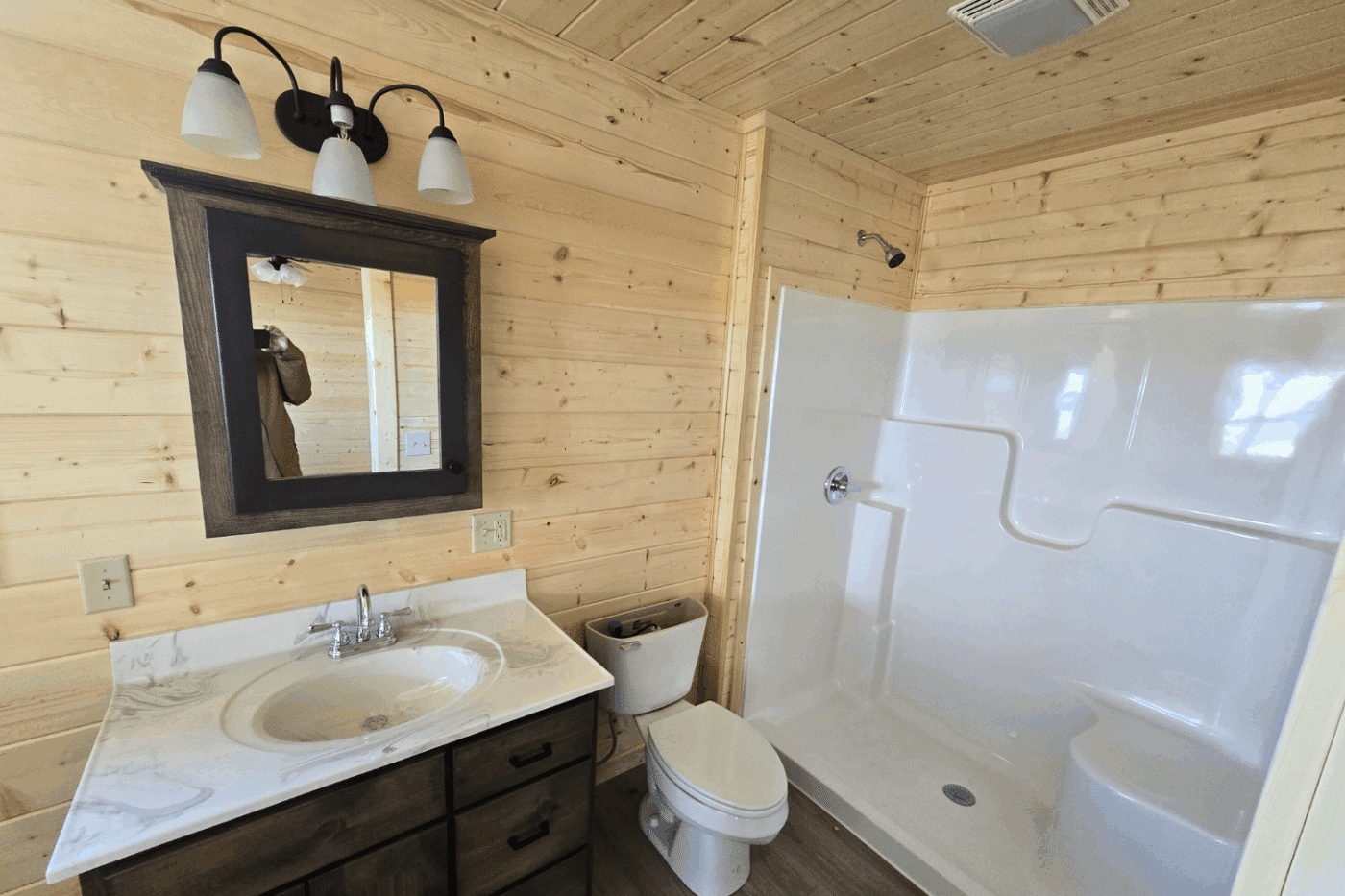 30x48 Log Glacier Cabin Holloway Angel Fire NM with large walk in shower built and designed by Psy Homes