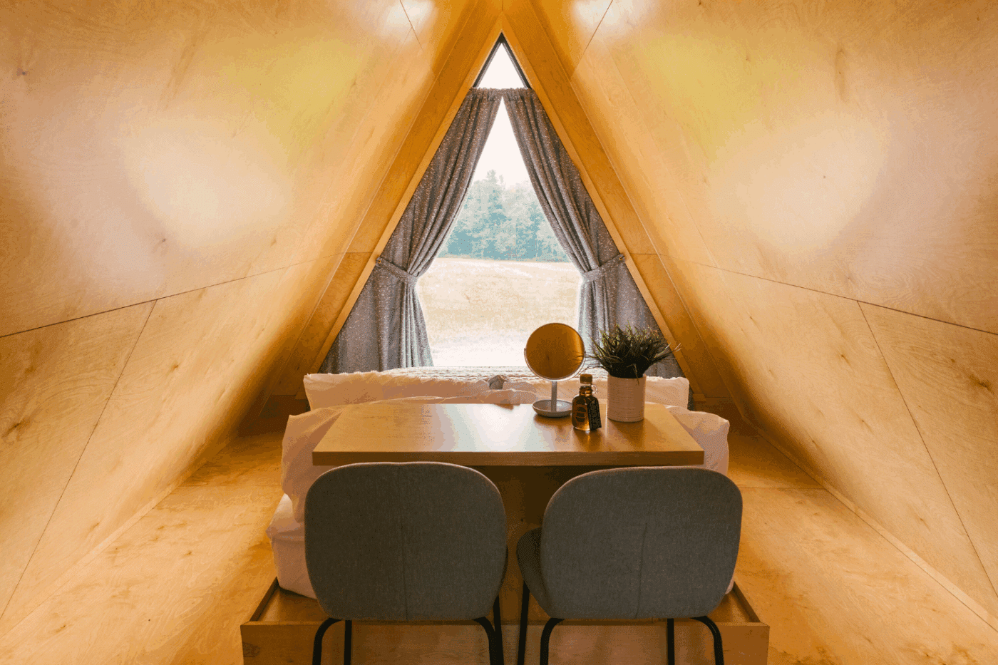 sleeping and dining area of Vista glamping pod built and designed by Psy Homes in Gap Pa