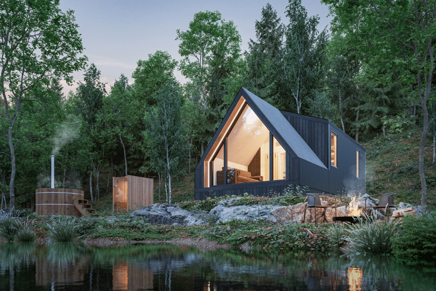 dark gray A frame ADU in the woods