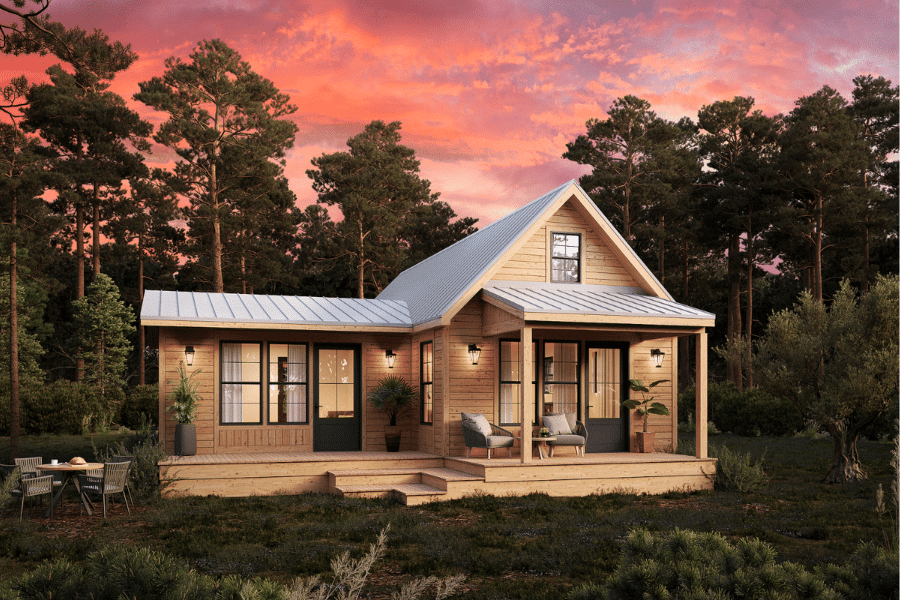 wooden grove ADU with light colored metal roofing in woods at sunset