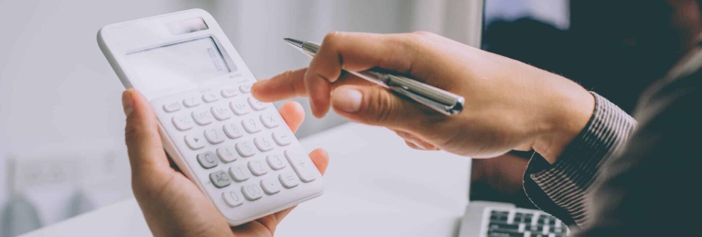 Business accounting, Businessman using calculator with budget do