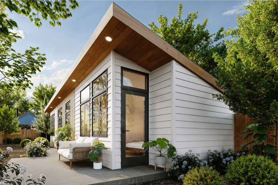 Sonoma ADU with white siding and wood paneling in a backyard