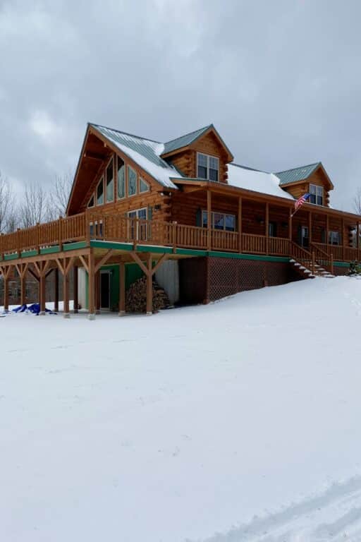 snow covered cabin in jewett new york