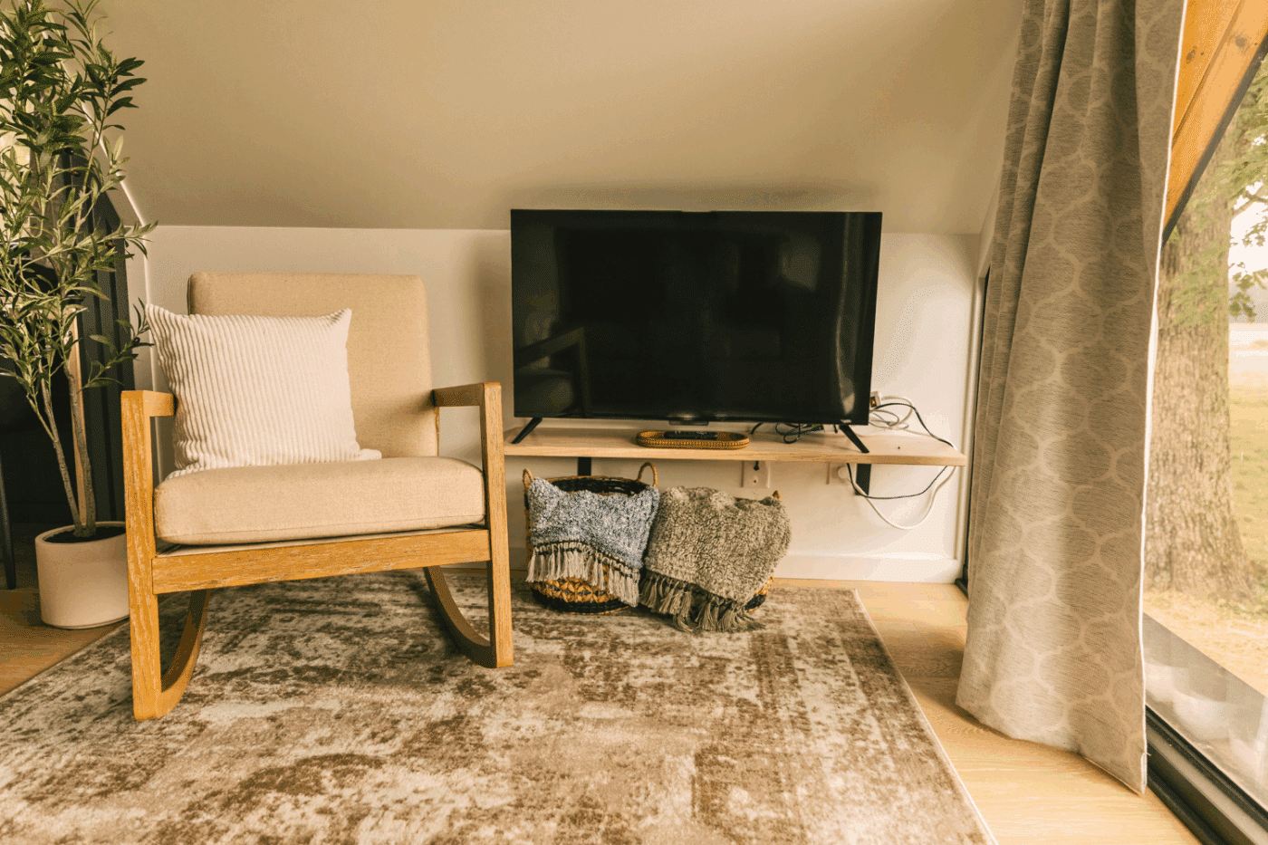 reading nook and tv of Aframe park model tiny home at somerset resort friedens pa site 11