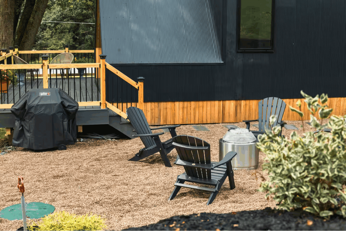 A frame park model tiny home built by zook cabisn with inviting outdoor hospitality area in gaines pa