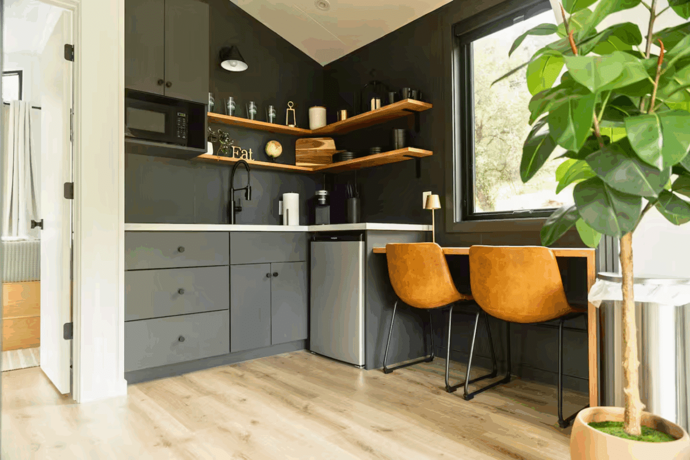 kitchen and dining in A frame Psy Homes park model tiny home in Gaines Pa