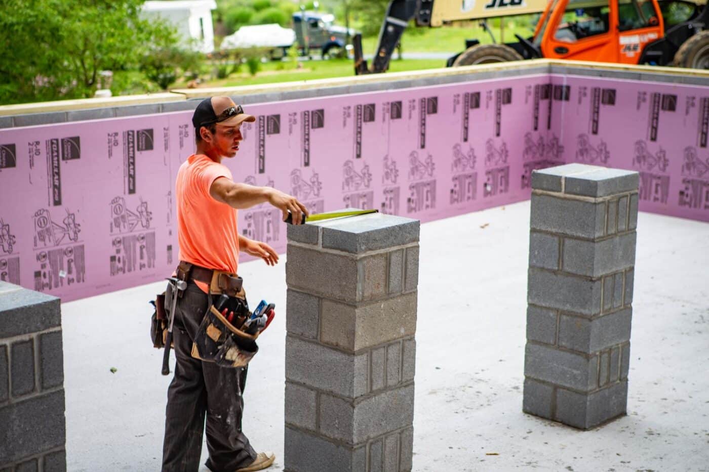 View of log cabin foundation with exposed crawl space before log cabin is placed on foundation
