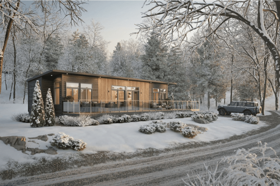 1 bedroom sonoma ADU with gray smart siding and wood paneling in woods during winter in Minnesota