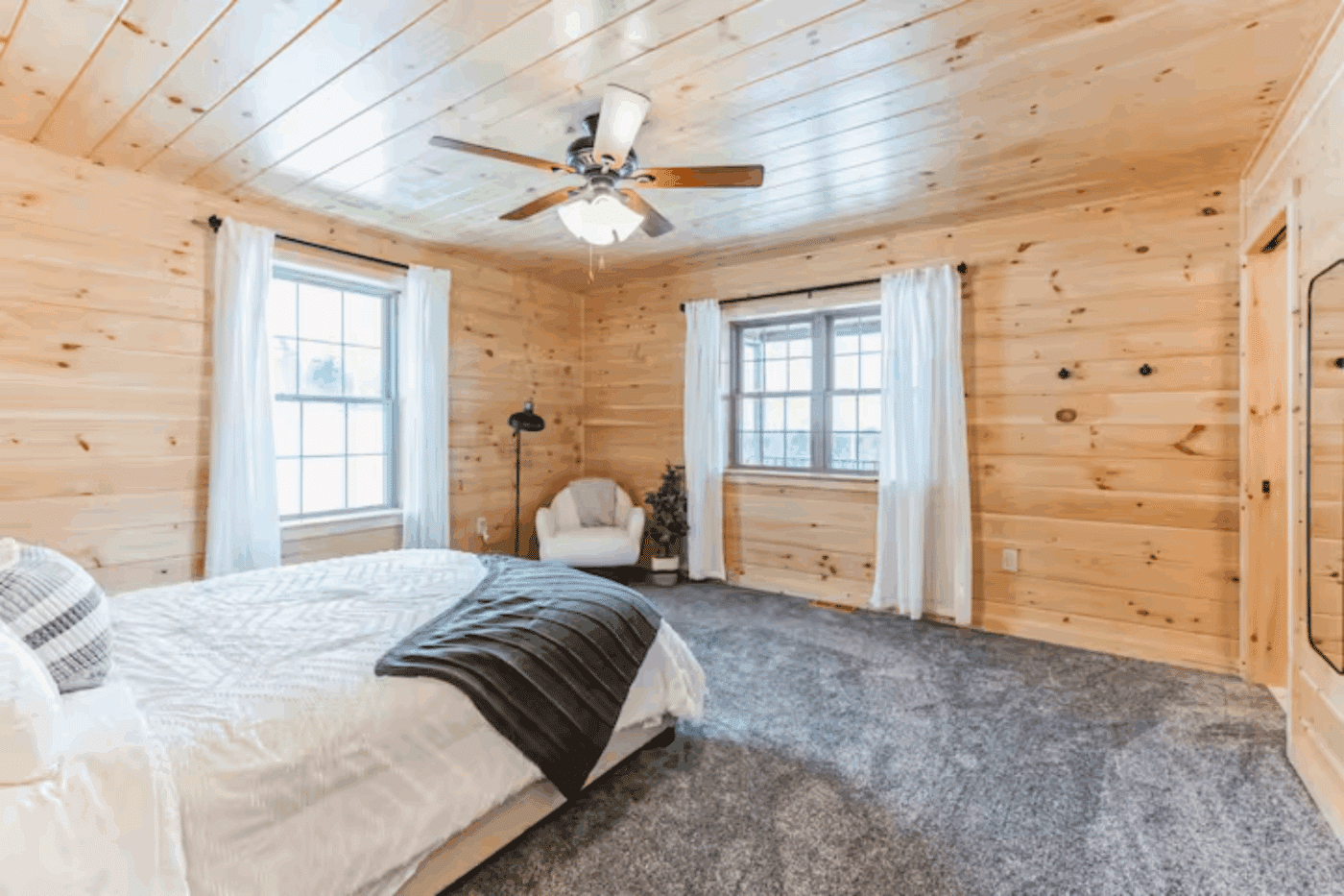 Master Bedroom of Mountaineer Deluxe in Sarnac Lake New York with en Suite