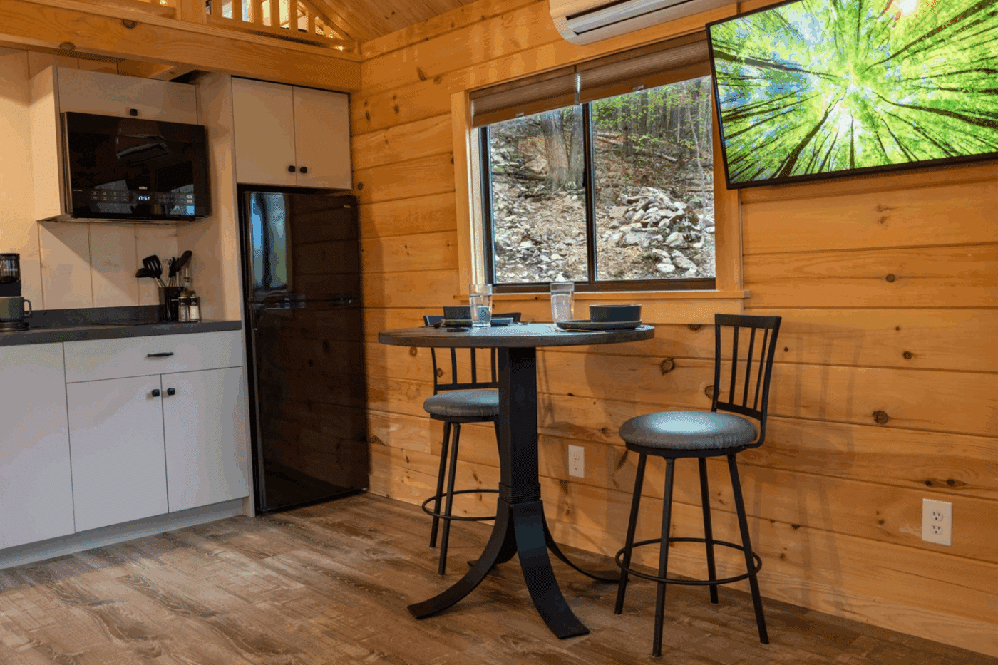 Psy Homes Park Model Tiny Home In Riverton Wester virginia kitchen and dining area in Aspen log tiny home