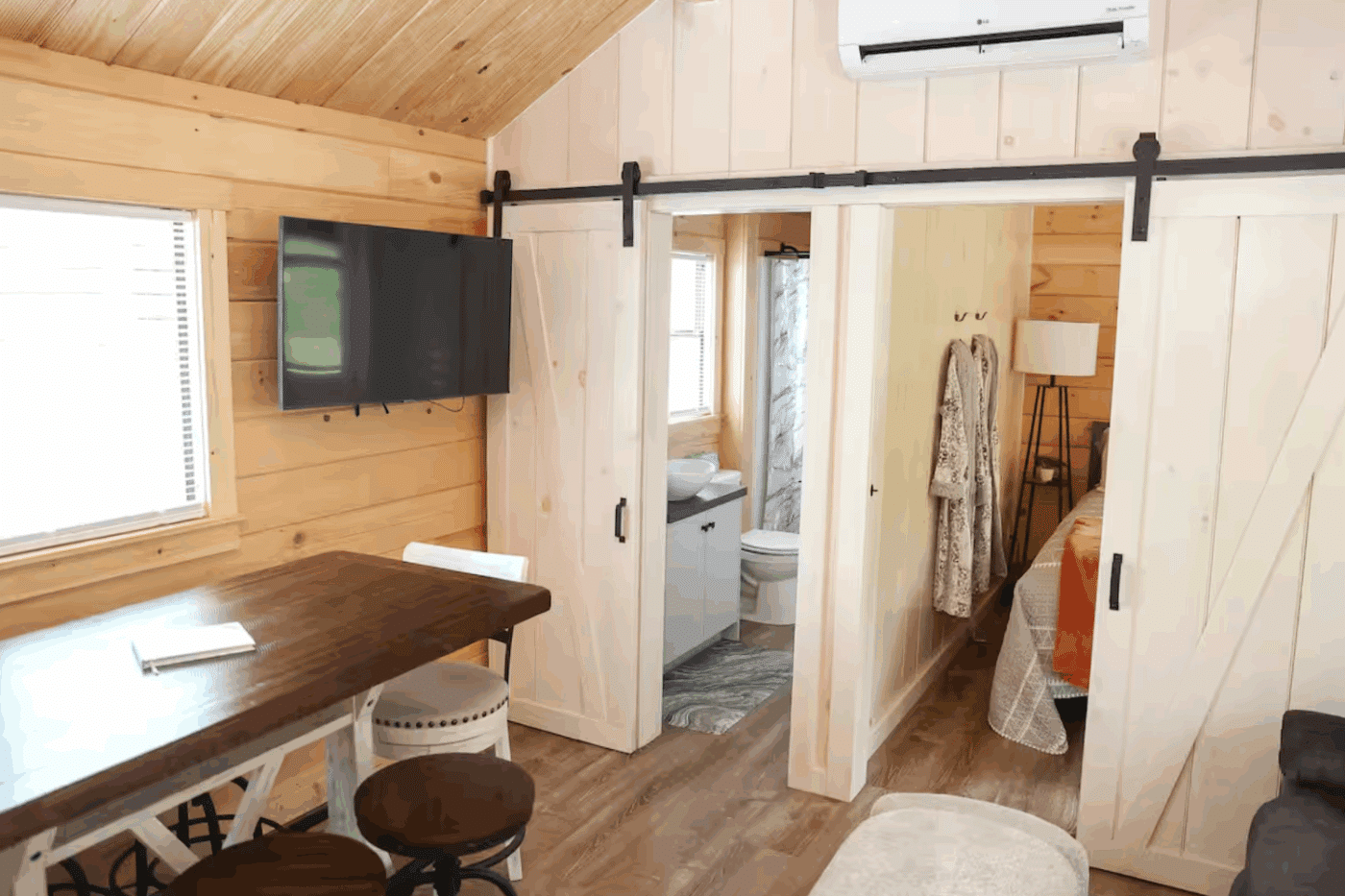 Pinecrest park model tiny home in Spring Mill Pa with large living and dining are built and designed by Psy Homes featuring second bedroom and large bathroom