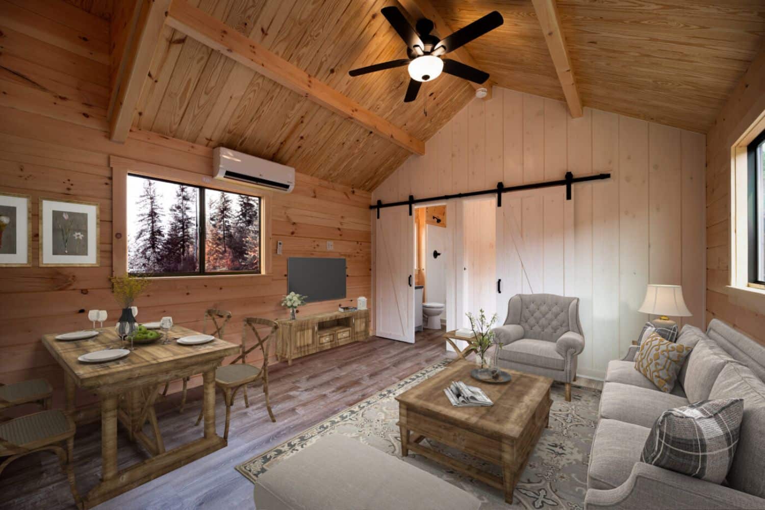 Tiny homes by county in Oregon. View of park model tiny home living room with sliding doors, kitchen table, and sofa