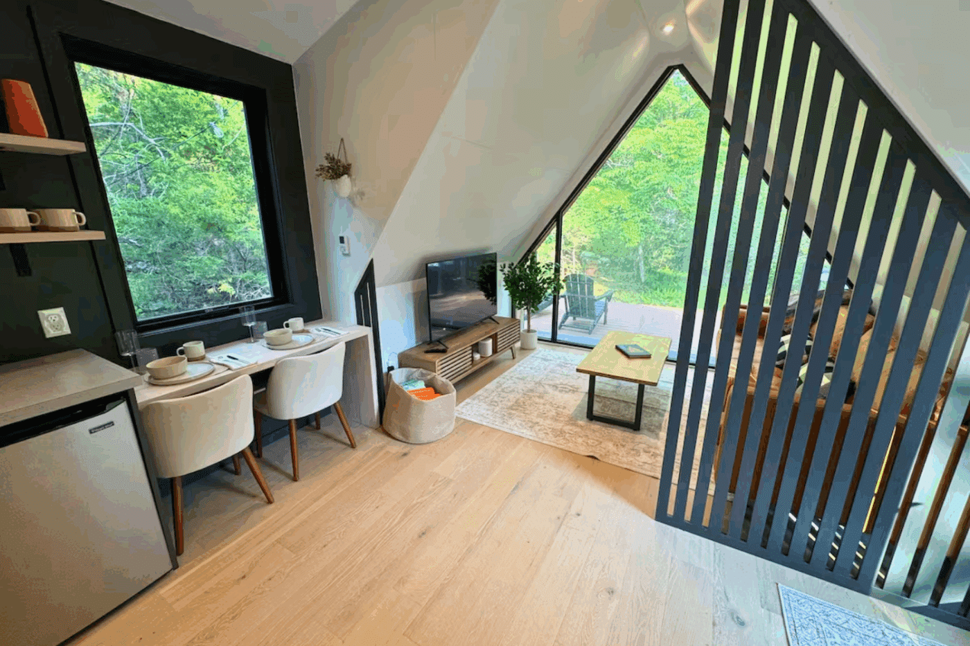 Dining Area and living room of A Frame Parkmodel tiny home in Wardensville West Virginia