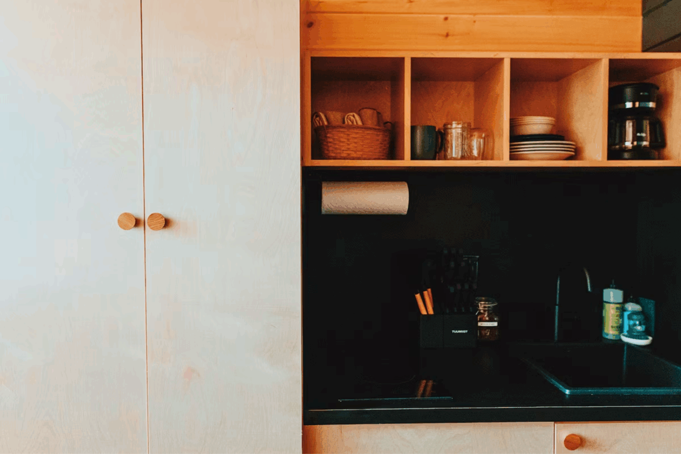 Kitchen and storage area of Nook Studio Peak Park Model tiny home in Northern Michigan at Retreat North Cabin 2