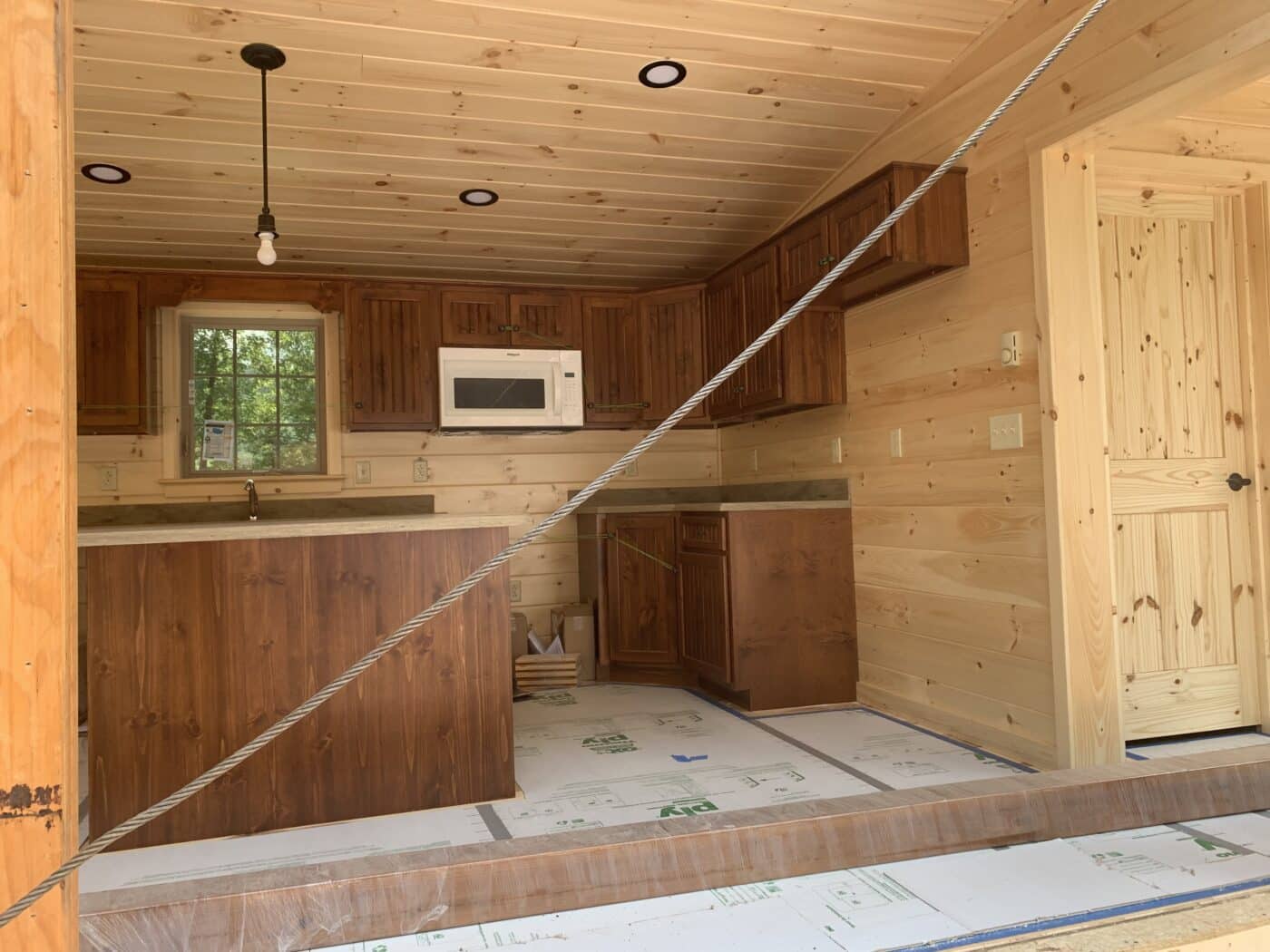 sneak peek at the unassembled pieces of a new prefab log cabin in parson west virginia