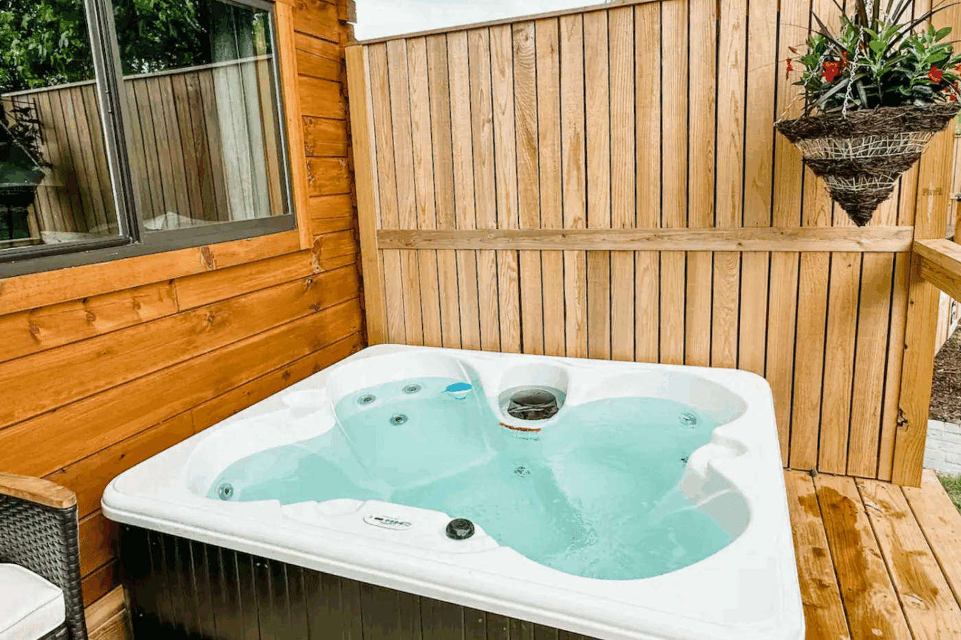 hot tub for outdoor entertainment in Harrison AR at Zook CAbins Pinecrest park model tiny home