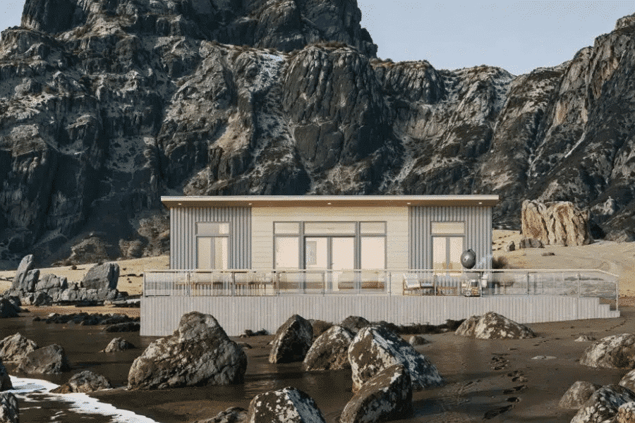 gray and white alpine tiny home on beach