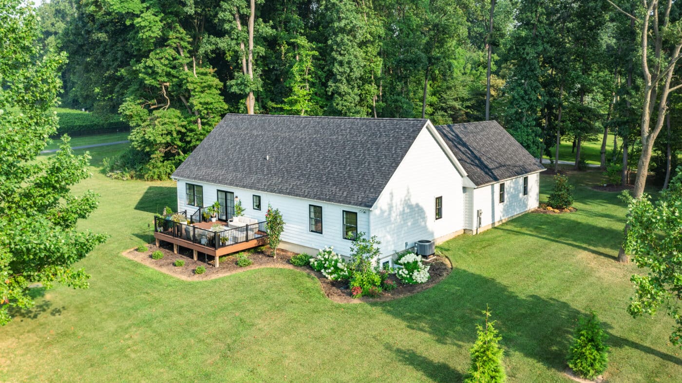 wide view of the deck and back of the homestead modern farmhouse