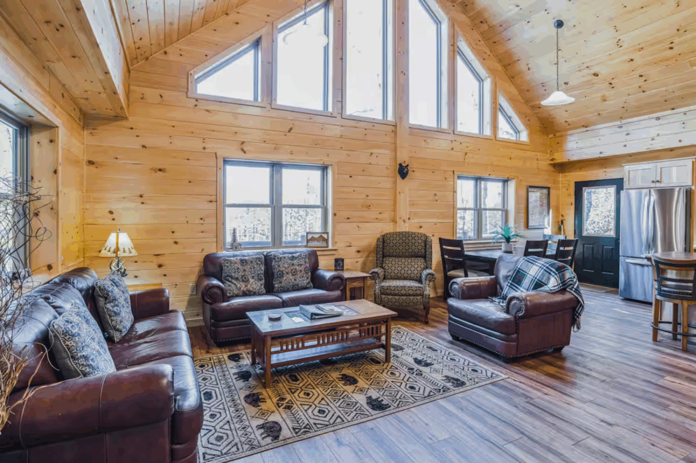 Living Room and dining area of Mountaineer Deluxe modular log cabin built and designed by Psy Homes