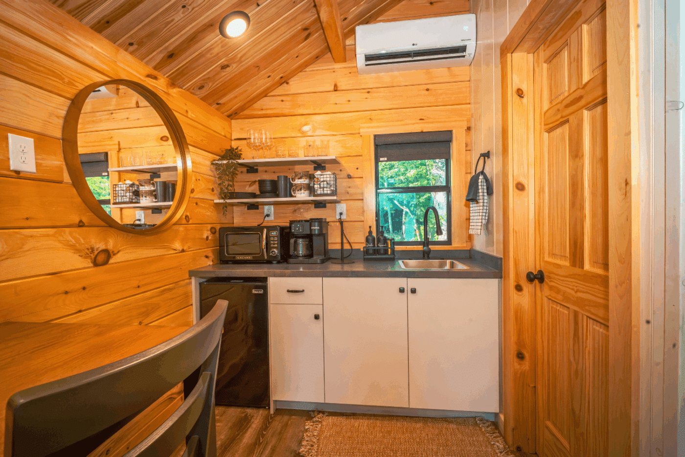 kitchen of log studio park model tiny home in pond eddy new york at the outpost cabin 3