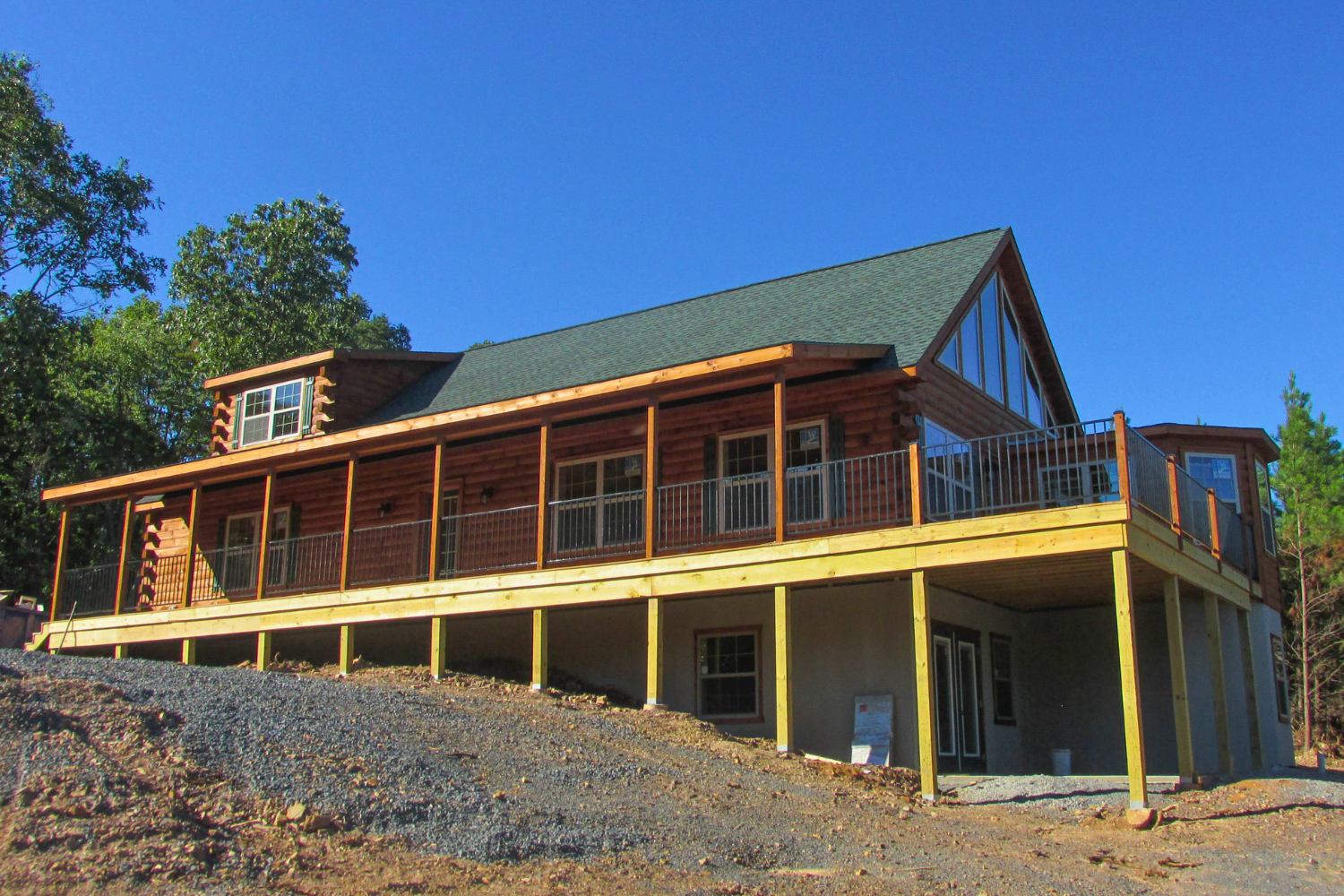 Log cabin placed on top of full basement foundation