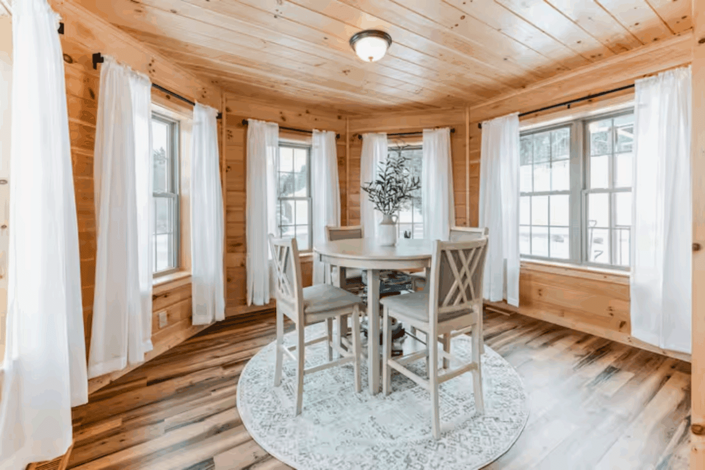 Breakfast nook of Log sided Mountaineer Deluxe in Sarnac Lake New York