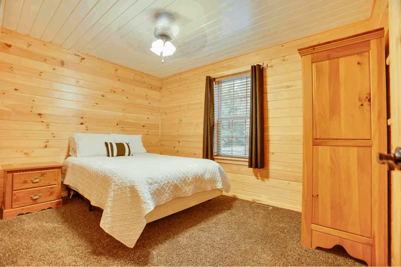 Bedroom 2 in mountaineer deluxe log cabin built and design ed with Psy Homes in Gap pa
