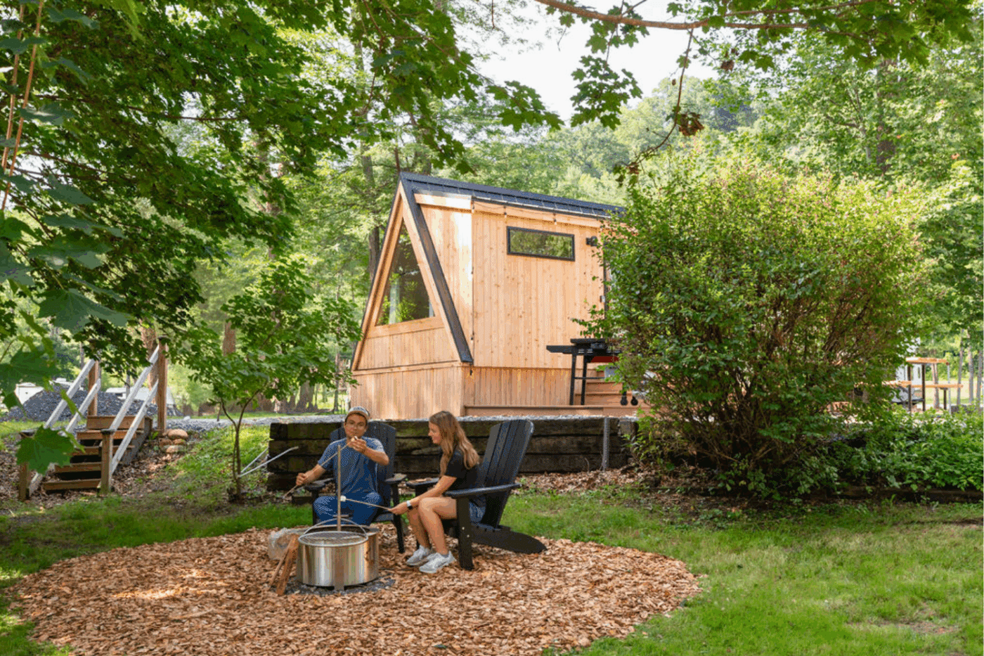 campfire pit with A frame custom built glamping pod site 31 in alxendria pa's Greene hill family resort