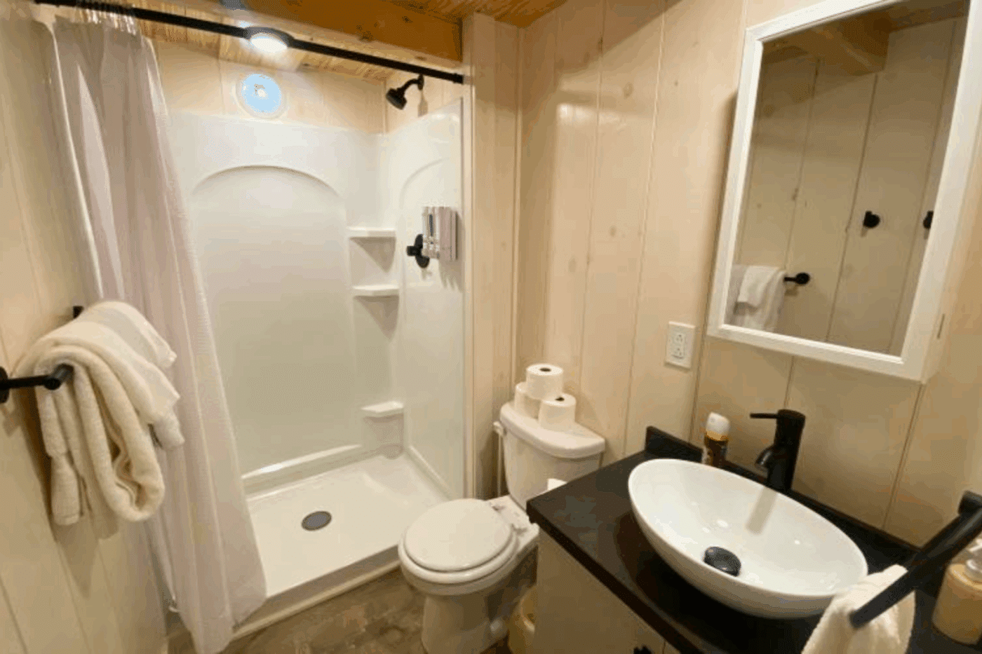full sized bathroom in Aspen 1 park model log tiny home in Michigan UP at Keweenaw Water Resort