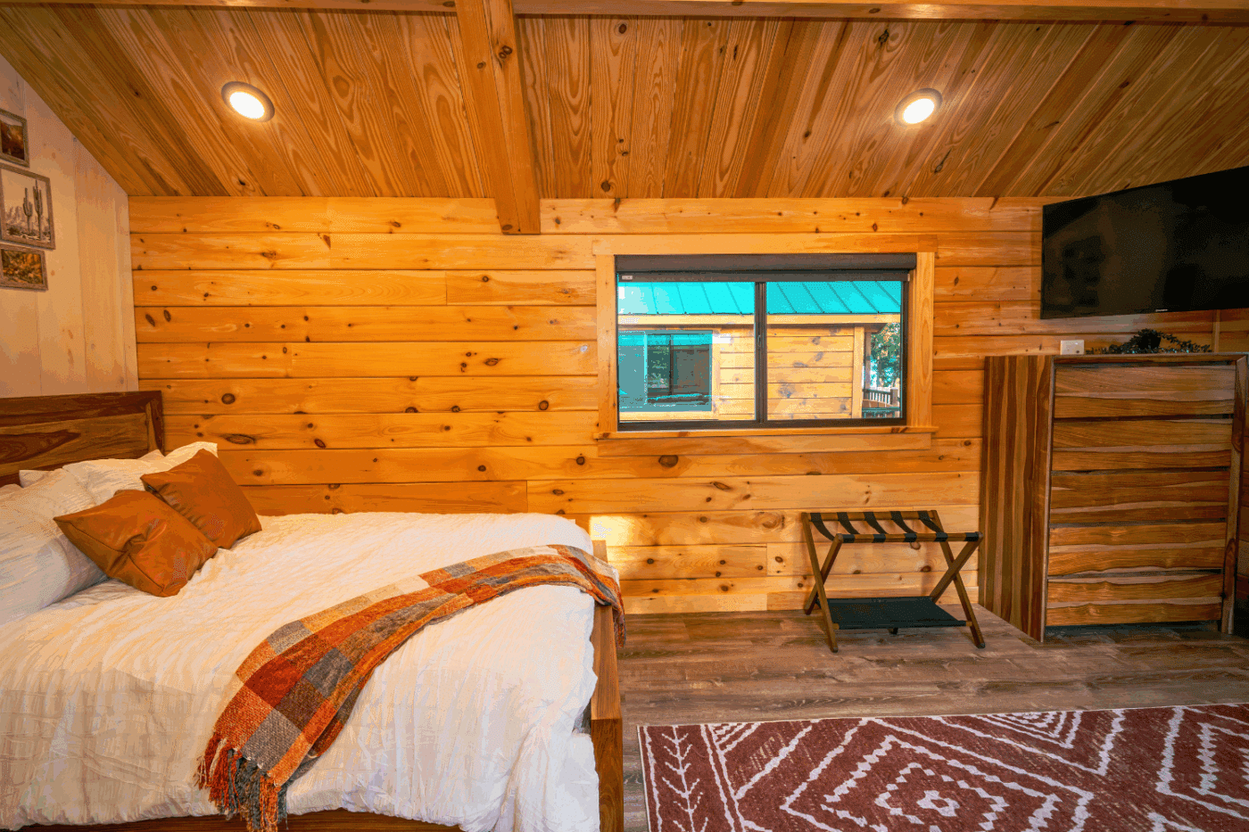 sleeping area of log studio park model tiny home built and designed by Psy Homes cabin 1