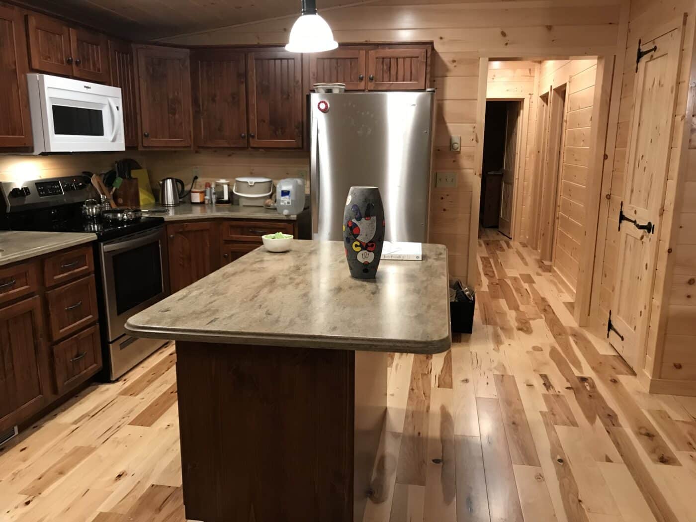 tasteful kitchen with beautiful cabinetry inside a prefab log cabin in parson west virginia