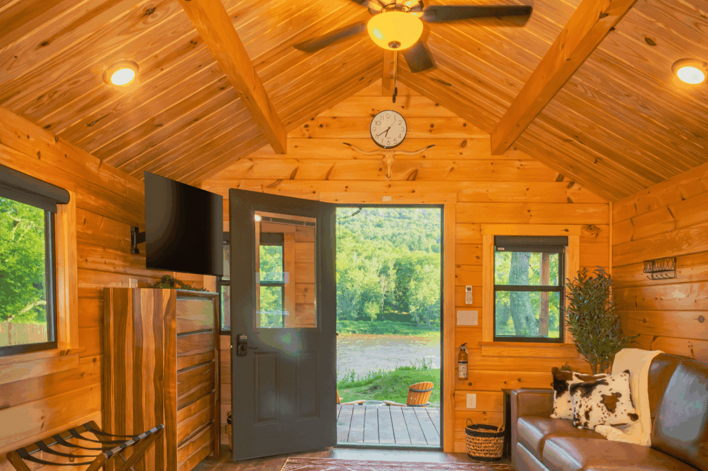 living room of studio log cabin park model tiny home at The outpost in pond eddy new york cabin 2
