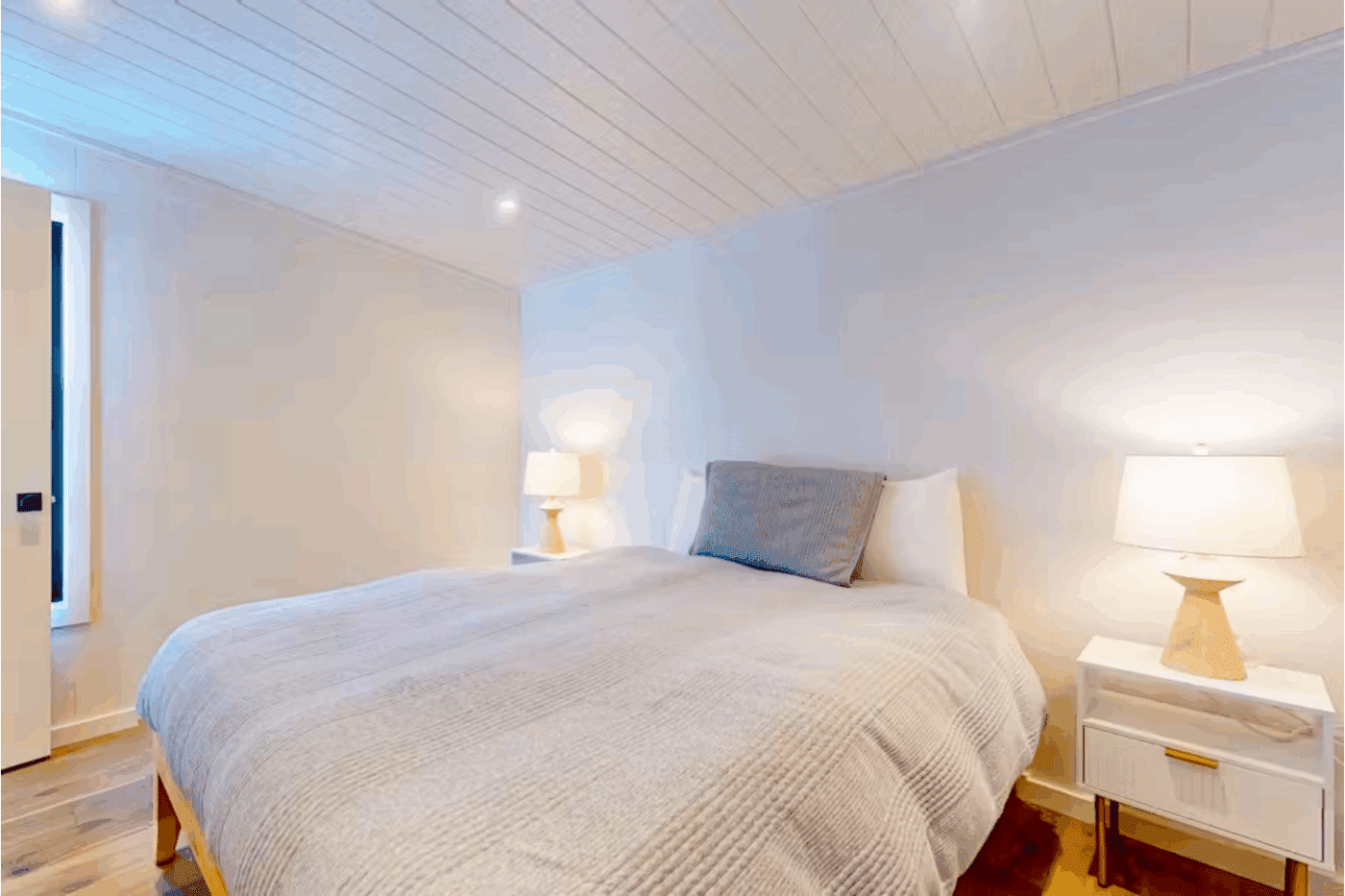 Large bedroom in Rockwood park model tiny home built and designed by Psy Homes