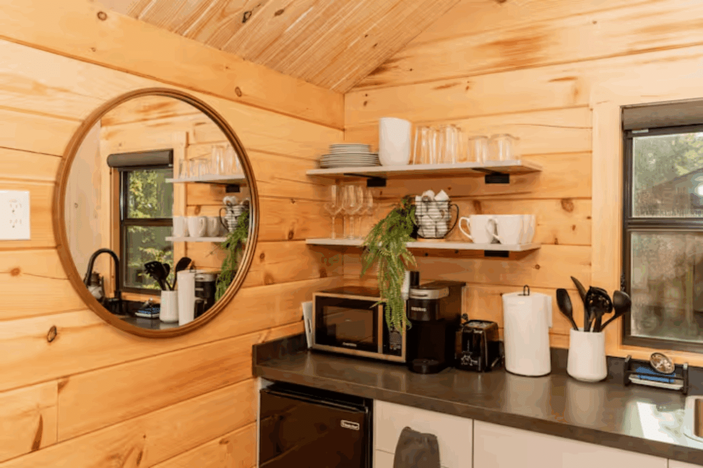 kitchen area of log studio park model tiny home in James Creek Pa studio 1
