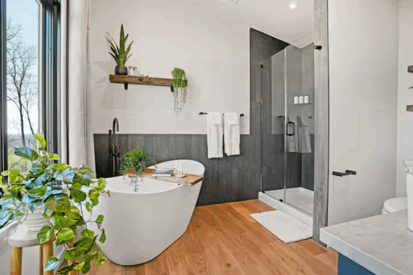 bathroom of alpine park model tiny home built by Zook CAbins in Pine Creek Township Pennsylvania with large soaking tub and walk in shower