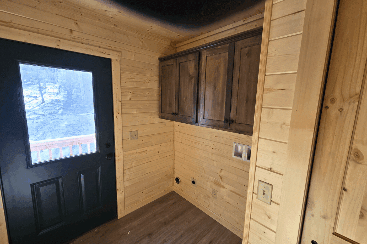 30x48 mudroom and laundry room in Log Cabin Glacier located in Holloway Angel Fire NM built and designed by Psy Homes