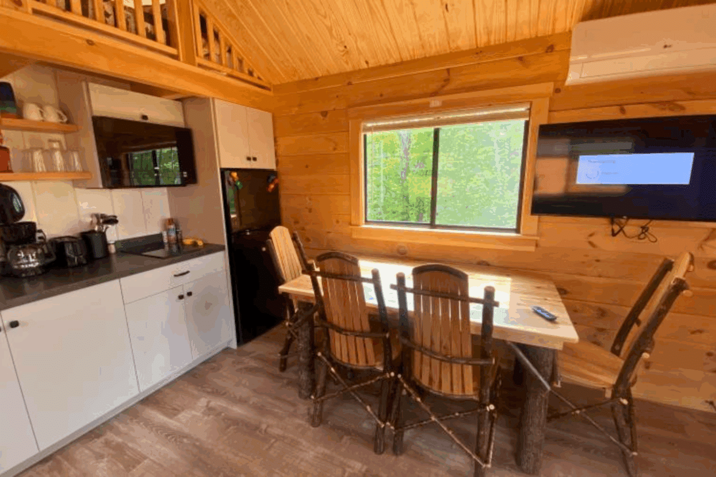 kitchen and dining area of Aspen 4 park model log tiny home in 49931