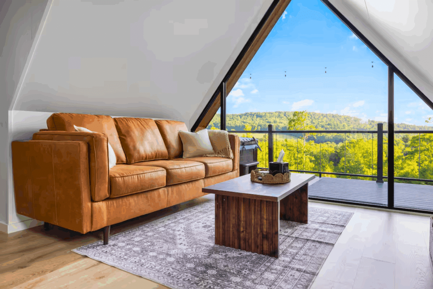 indoor sitting area in nook of A frame studio park model tiny home built and designed by Psy Homes